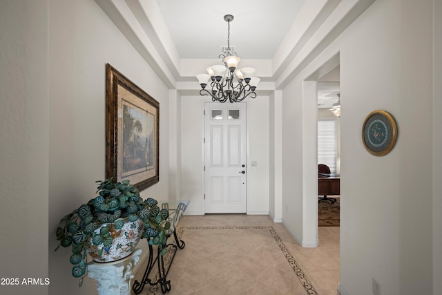 2163 N 164th Dr, Goodyear, AZ 85395 - foyer entrance with a chandelier, light tile patterned flooring, and inlaid floor details
