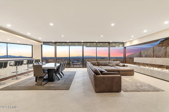 living room featuring floor to ceiling windows