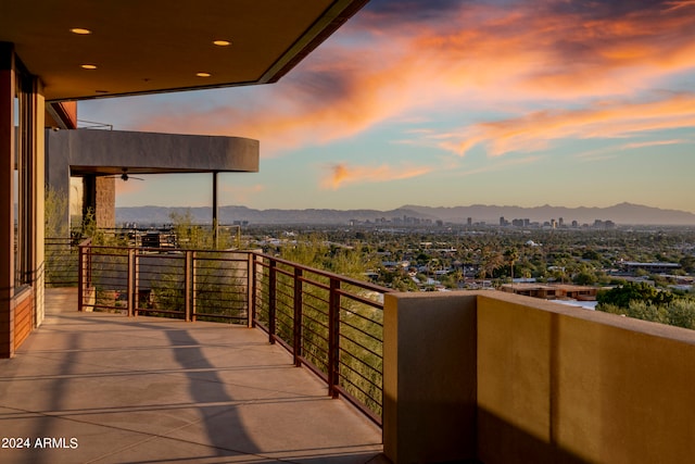 balcony at dusk with a mountain view