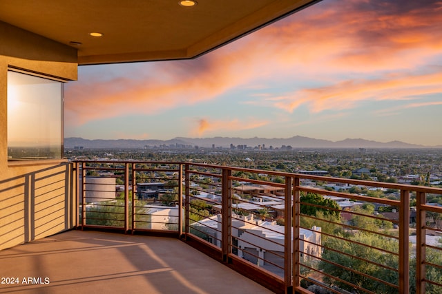 balcony at dusk with a mountain view