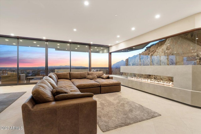 living room featuring floor to ceiling windows