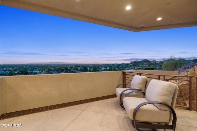 view of balcony at dusk