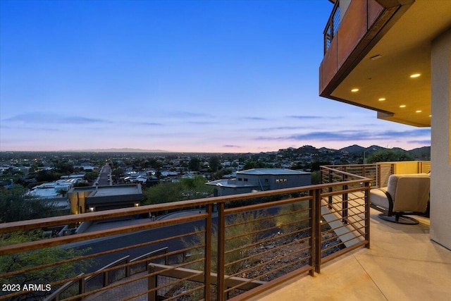 view of balcony at dusk