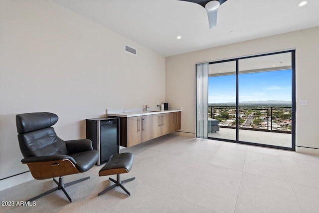 living area featuring ceiling fan