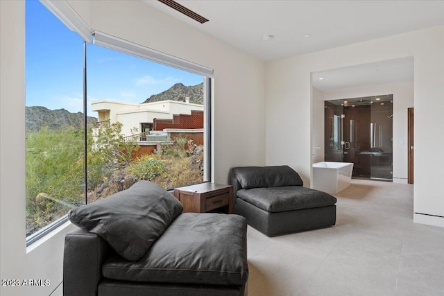 sitting room featuring a mountain view