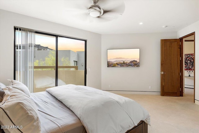 carpeted bedroom with a baseboard radiator, access to exterior, and ceiling fan