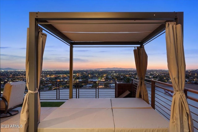 patio terrace at dusk with a balcony