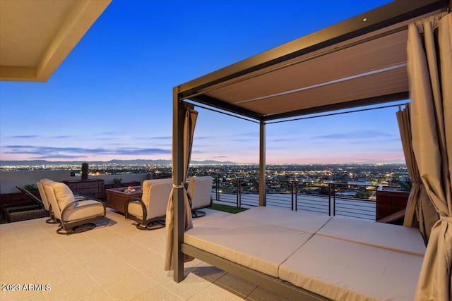 patio terrace at dusk with a balcony