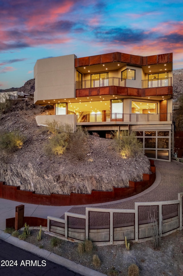 exterior space with a balcony and a mountain view