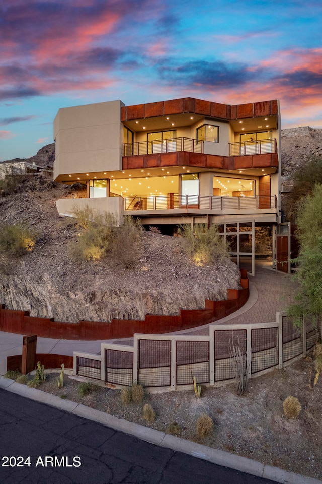 view of front of home featuring a balcony and a mountain view