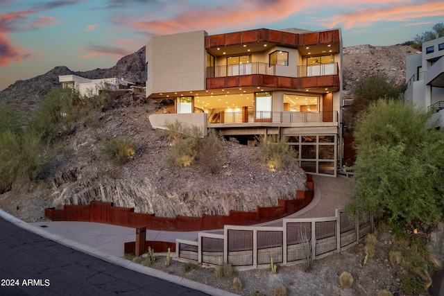 exterior space with a mountain view and a balcony