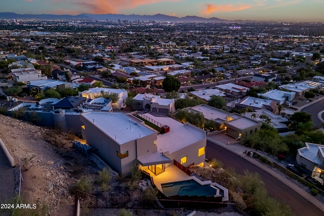 aerial view at dusk with a mountain view