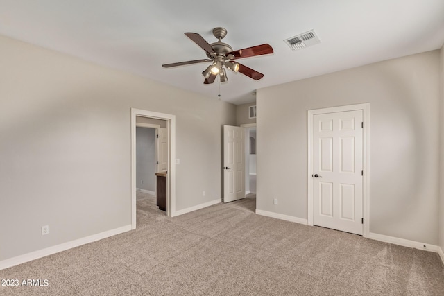 unfurnished bedroom with light colored carpet and ceiling fan