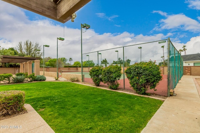 view of yard featuring tennis court