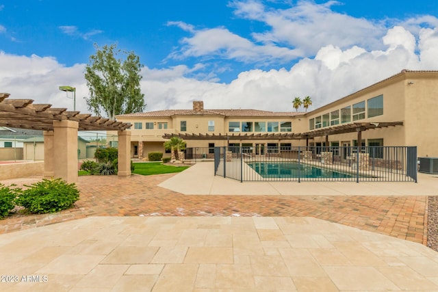 view of pool with a pergola, a patio, and central air condition unit