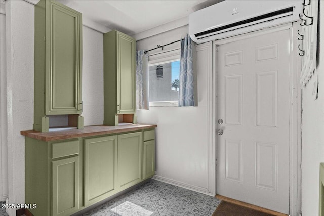 doorway to outside featuring an AC wall unit