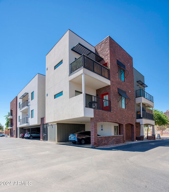 view of building exterior with a carport