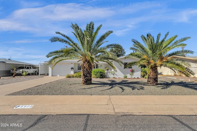 view of front of house featuring driveway and a garage