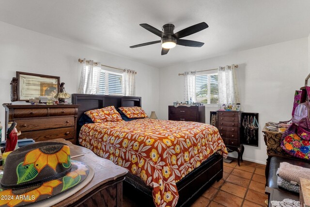 tiled bedroom with ceiling fan