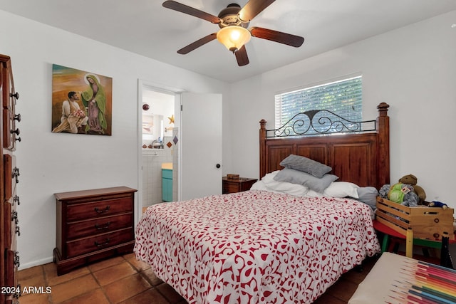 bedroom with ceiling fan, tile patterned flooring, and ensuite bathroom