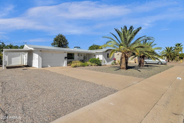 view of front of property with a garage and driveway