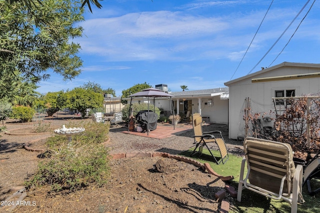 rear view of house with a patio