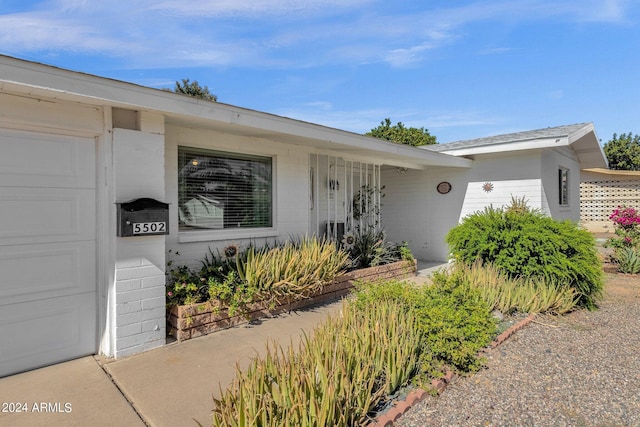 property entrance with an attached garage