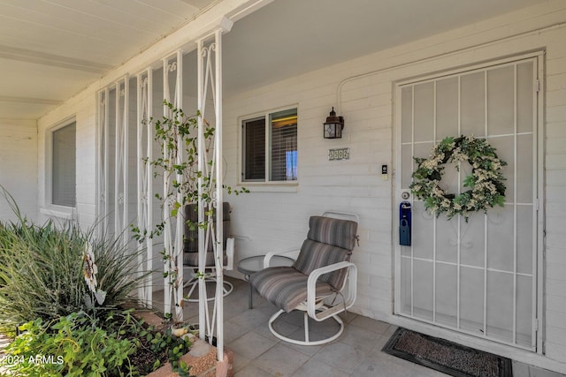 view of exterior entry featuring a porch