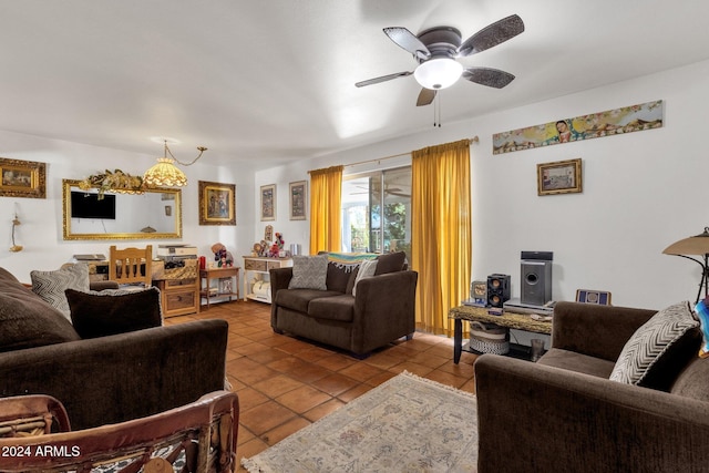 tiled living room with a ceiling fan