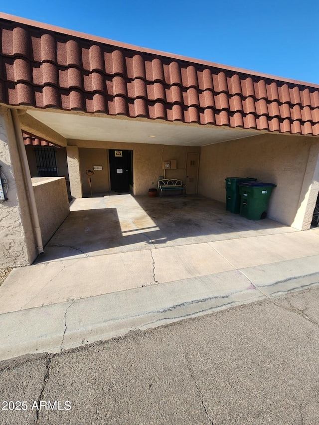 view of parking with a carport