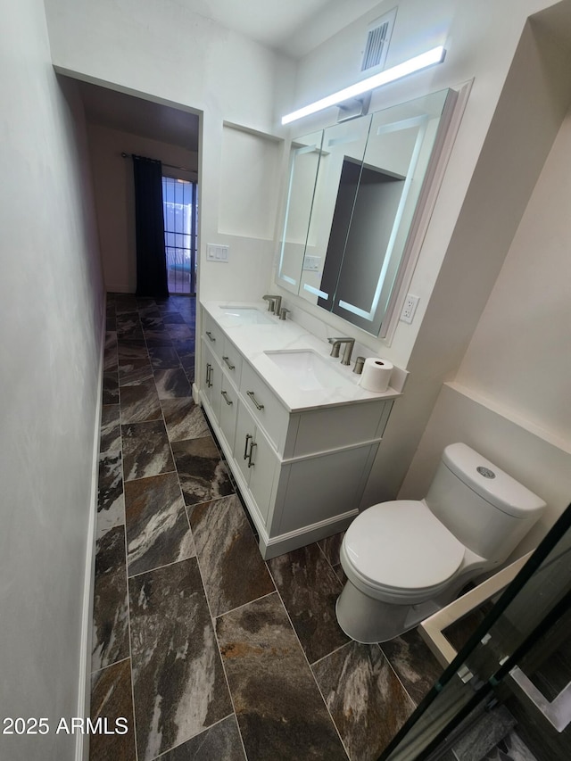 bathroom with vanity and toilet