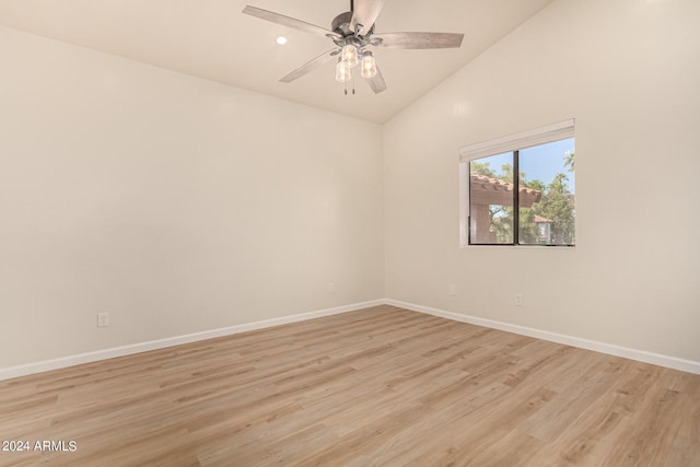 unfurnished room featuring lofted ceiling, ceiling fan, light wood-style flooring, and baseboards