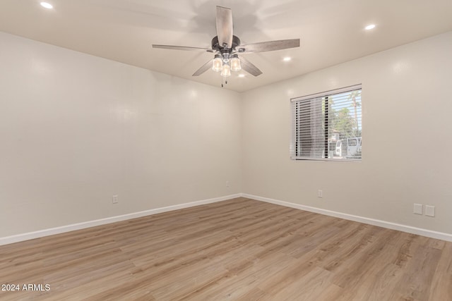 unfurnished room featuring light wood-style flooring, baseboards, a ceiling fan, and recessed lighting