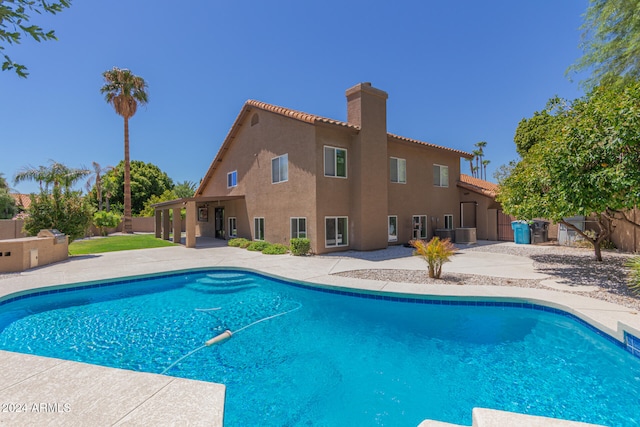 view of pool featuring a fenced backyard, a fenced in pool, and a patio