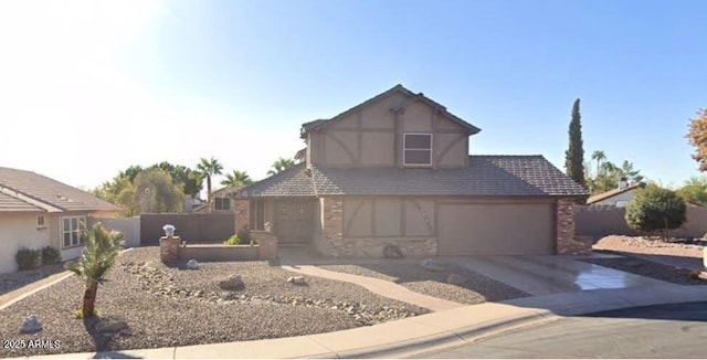 4547 E Buist Ave, Phoenix, AZ 85044 - tudor home with concrete driveway and stucco siding