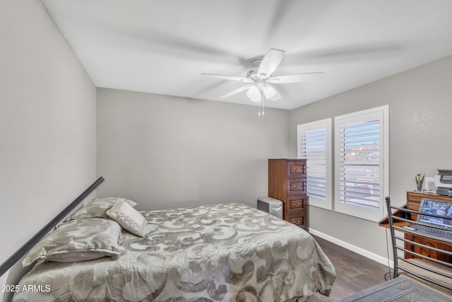 4547 E Buist Ave, Phoenix, AZ 85044 - bedroom with dark wood-style flooring and ceiling fan