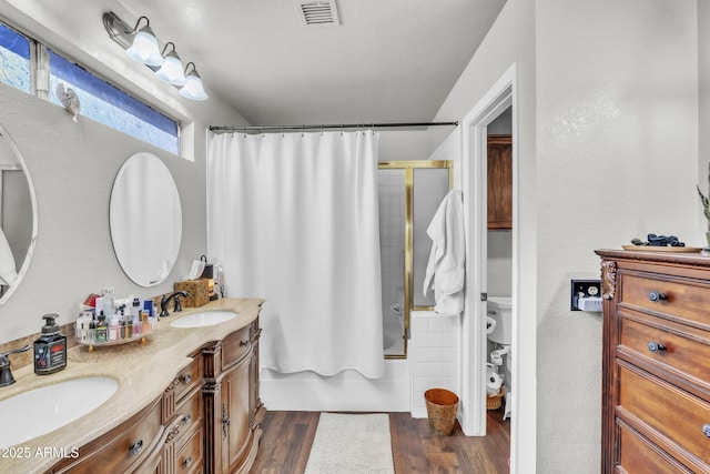 4547 E Buist Ave, Phoenix, AZ 85044 - full bathroom with shower / tub combo, double vanity, and wood finished floors