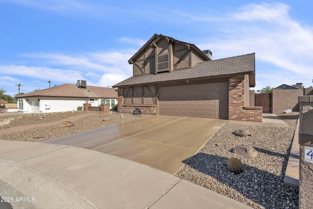 4547 E Buist Ave, Phoenix, AZ 85044 - tudor home with brick siding and concrete driveway