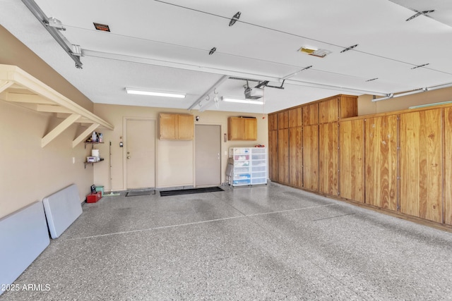 4547 E Buist Ave, Phoenix, AZ 85044 - garage featuring a garage door opener
