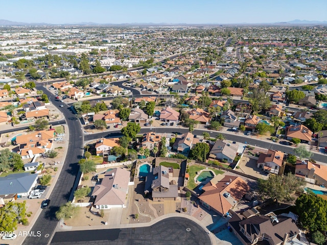 4547 E Buist Ave, Phoenix, AZ 85044 - aerial view of property and surrounding area with nearby suburban area and a mountain backdrop