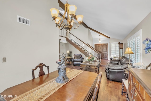 4547 E Buist Ave, Phoenix, AZ 85044 - dining room with stairway, wood finished floors, a chandelier, beamed ceiling, and high vaulted ceiling