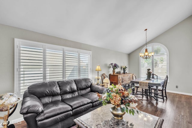 4547 E Buist Ave, Phoenix, AZ 85044 - living area with a chandelier, dark wood-style flooring, and lofted ceiling