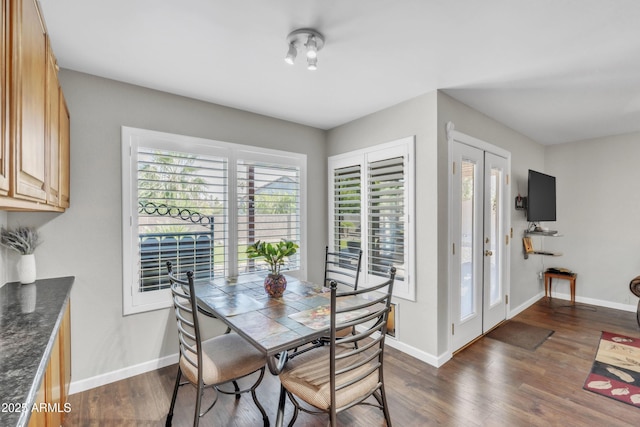 4547 E Buist Ave, Phoenix, AZ 85044 - dining space with dark wood-type flooring and french doors