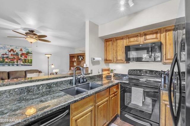 4547 E Buist Ave, Phoenix, AZ 85044 - kitchen with black appliances, a ceiling fan, dark stone counters, brown cabinetry, and light wood-style floors