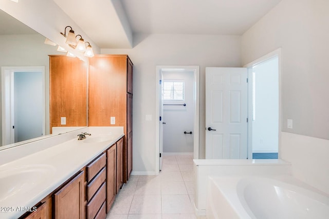 full bath with tile patterned flooring, a sink, a bath, and double vanity