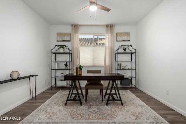 home office featuring dark hardwood / wood-style floors and ceiling fan