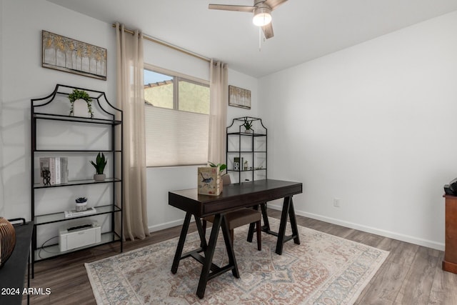 office with hardwood / wood-style floors and ceiling fan