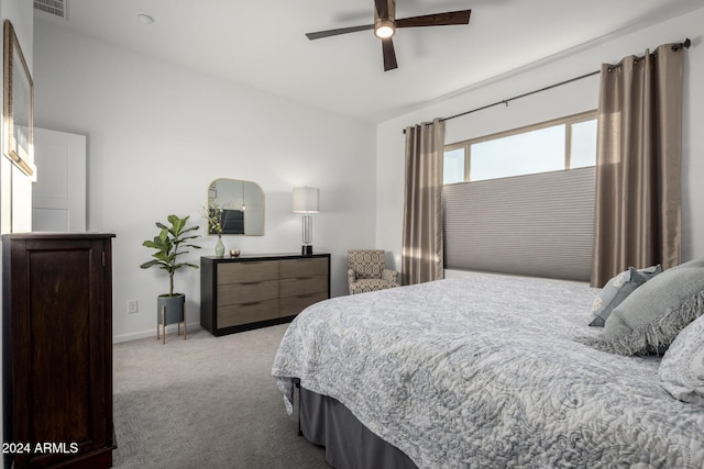 bedroom featuring ceiling fan and light colored carpet