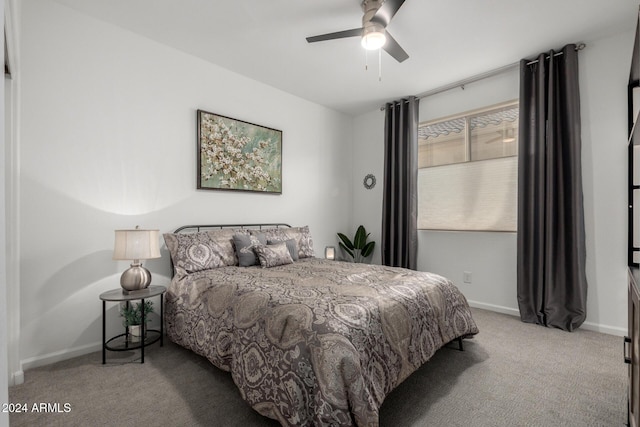 bedroom with light carpet and ceiling fan