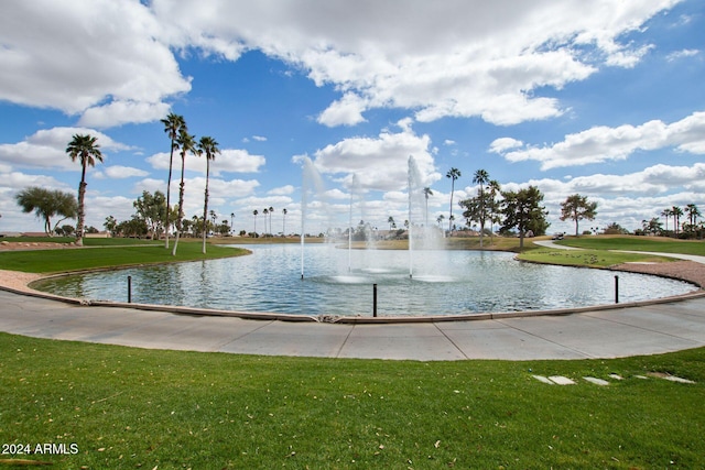 view of property's community with a yard and a water view